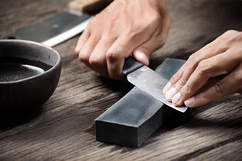 Sharpening the knife with whetstone