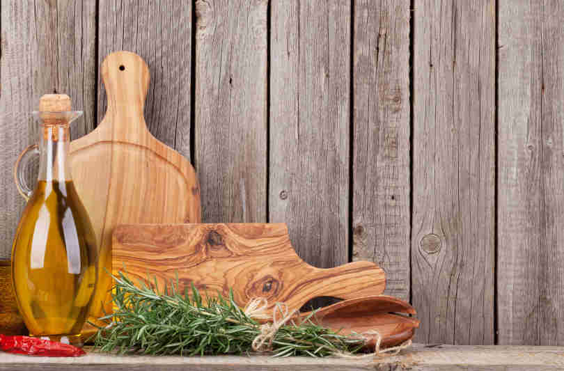 Cutting and cutting board oil in a on a wooden board