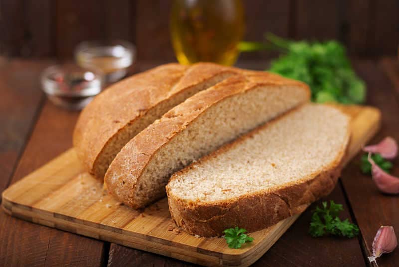 Homemade bread sliced on a board