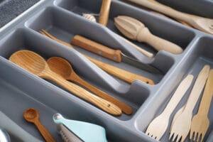 Set of clean kitchen utensils in drawer
